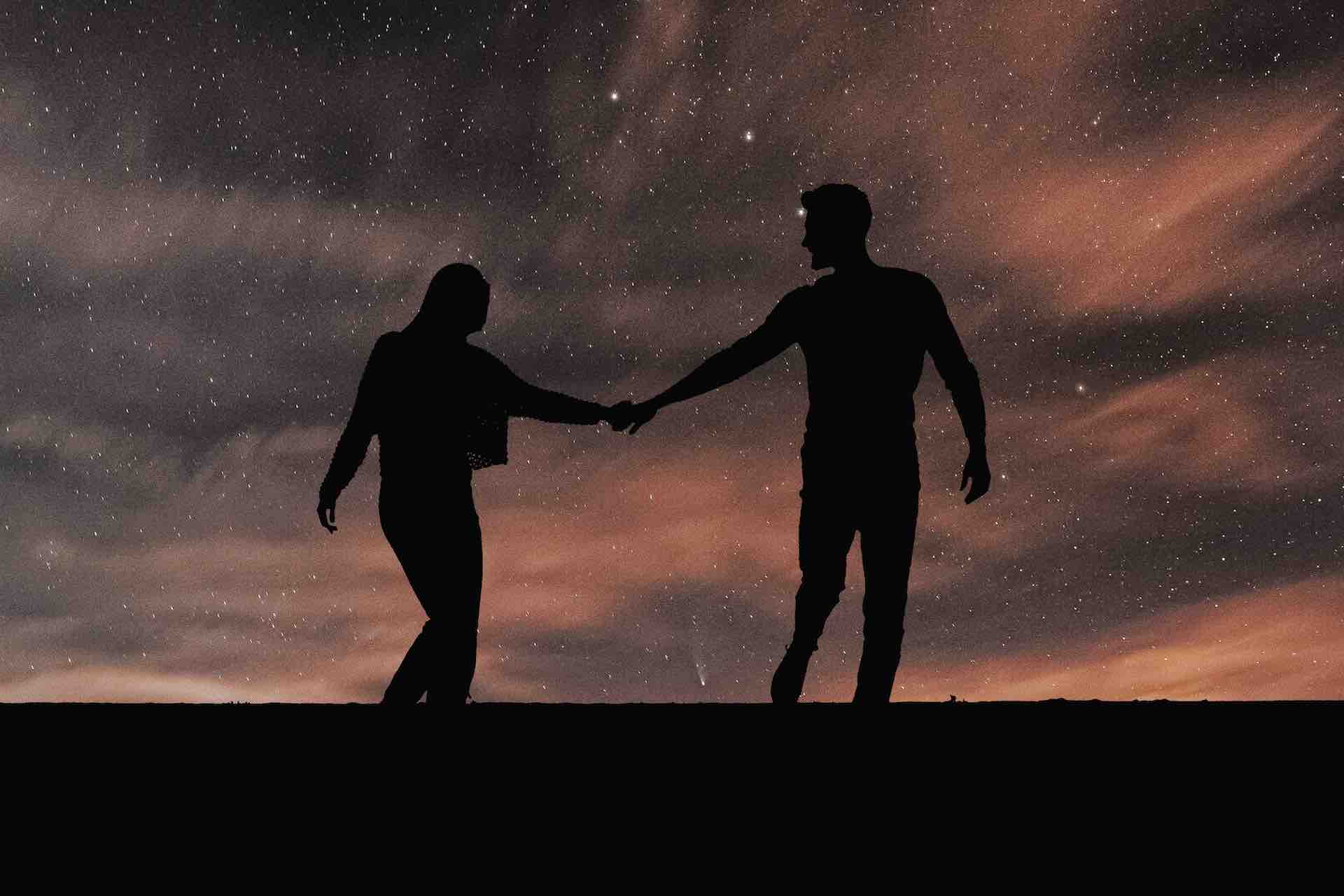 couple lovers in romantic silhouette sky background