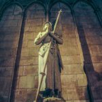 statue of a saint in notre dame cathedral paris france