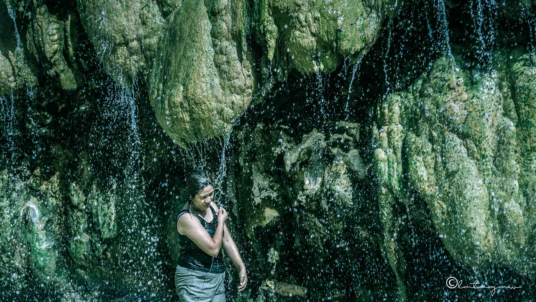 woman at mainit hot spring falls philippines